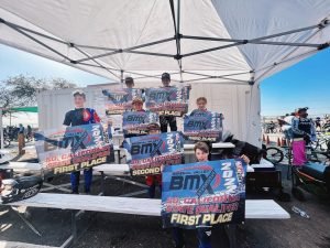 Team holding banners