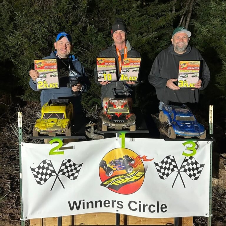 RC racers holding up a plaque from BML